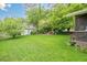 Beautiful backyard with lush green lawn, detached garage and fire pit at 2497 Edwards Nw Dr, Atlanta, GA 30318