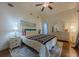 This bedroom features hardwood floors, light colored walls, and a comfortable bed with colorful blankets at 2497 Edwards Nw Dr, Atlanta, GA 30318