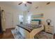 This bedroom features hardwood floors, light colored walls, and a comfortable bed with colorful blankets at 2497 Edwards Nw Dr, Atlanta, GA 30318