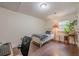 A cozy bedroom with hardwood floors, a bed, a desk and chair, and a window overlooking the yard at 2497 Edwards Nw Dr, Atlanta, GA 30318