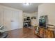 Versatile bedroom with hardwood floors, double doors, desk, and storage, suitable for an office or hobby room at 2497 Edwards Nw Dr, Atlanta, GA 30318