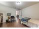 A bright bedroom features hardwood floors, a window, a desk, and a bed at 2497 Edwards Nw Dr, Atlanta, GA 30318