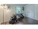 Cozy bedroom features hardwood floors, shuttered windows, and a music setup, perfect for a relaxing atmosphere at 2497 Edwards Nw Dr, Atlanta, GA 30318
