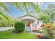 Charming home featuring a bright red front door, a lovely green lawn, and a white picket fence at 2497 Edwards Nw Dr, Atlanta, GA 30318