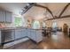 Bright kitchen with stainless steel appliances, granite counters, island, and open access to the living and dining areas at 2497 Edwards Nw Dr, Atlanta, GA 30318