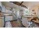 Well-appointed kitchen with stainless steel appliances, granite countertops, and breakfast bar seating at 2497 Edwards Nw Dr, Atlanta, GA 30318