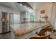 Bright kitchen featuring granite countertops, stainless steel appliances, and convenient bar seating at 2497 Edwards Nw Dr, Atlanta, GA 30318