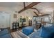 Inviting living room with hardwood floors, wood beams, and a seamless flow into the modern kitchen at 2497 Edwards Nw Dr, Atlanta, GA 30318