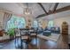 Comfortable living space featuring open floor plan, natural light, and views of the backyard play set at 2497 Edwards Nw Dr, Atlanta, GA 30318