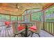 Comfortable patio with a ceiling fan, outdoor seating, and view of the greenery at 2497 Edwards Nw Dr, Atlanta, GA 30318
