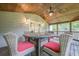 Relaxing screened in porch offering an outdoor seating arrangement and wooden ceiling with fan at 2497 Edwards Nw Dr, Atlanta, GA 30318
