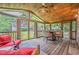 Screened in back porch with a table and chairs, outdoor seating, and view of the backyard at 2497 Edwards Nw Dr, Atlanta, GA 30318