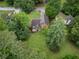 Aerial view of a two-story home showcasing a spacious backyard and a deck for outdoor enjoyment at 4896 Muirwood Dr, Powder Springs, GA 30127