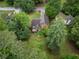 Aerial view of a two-story home showcasing a spacious backyard and a deck for outdoor enjoyment at 4896 Muirwood Dr, Powder Springs, GA 30127