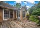 Exterior view of deck made of wood, siding, back door and windows at 4896 Muirwood Dr, Powder Springs, GA 30127