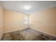 Cozy carpeted bedroom with neutral walls and a window offering natural light at 4896 Muirwood Dr, Powder Springs, GA 30127