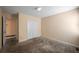 This bedroom features neutral paint, carpet, and closet with double doors at 4896 Muirwood Dr, Powder Springs, GA 30127