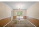 Dining room with large window and neutral color scheme, with views of backyard at 4896 Muirwood Dr, Powder Springs, GA 30127