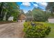 Charming two-story home with a manicured lawn, mature trees, and a two-car garage, creating curb appeal at 4896 Muirwood Dr, Powder Springs, GA 30127
