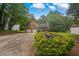 Charming two-story home with a manicured lawn, mature trees, and a two-car garage, creating curb appeal at 4896 Muirwood Dr, Powder Springs, GA 30127