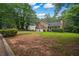 Charming two-story home with a well-manicured lawn and mature trees in a peaceful setting at 4896 Muirwood Dr, Powder Springs, GA 30127