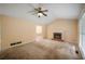 Spacious living room features a brick fireplace, vaulted ceiling, and ample natural light at 4896 Muirwood Dr, Powder Springs, GA 30127