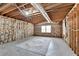 Unfinished basement featuring a large area rug on concrete flooring and exposed insulation on the walls at 93 Ridgetree Ln, Marietta, GA 30068