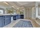 A spacious bathroom features blue vanity with ample counter space, tile floors, and a glass shower at 93 Ridgetree Ln, Marietta, GA 30068