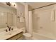 Bathroom with white vanity, toilet, and a shower-tub combination with white tile at 93 Ridgetree Ln, Marietta, GA 30068