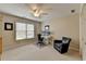 Bedroom showcasing a ceiling fan, a white desk, and a comfortable chair at 93 Ridgetree Ln, Marietta, GA 30068