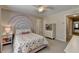 A cozy bedroom with a decorative mural, neutral walls, and carpet floors at 93 Ridgetree Ln, Marietta, GA 30068