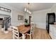 Dining room with hardwood floors, chandelier, wainscoting, and staircase nearby at 93 Ridgetree Ln, Marietta, GA 30068