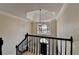 Elegant foyer with modern chandelier, staircase, and large window highlighting the entrance at 93 Ridgetree Ln, Marietta, GA 30068