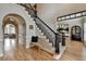 Elegant foyer area featuring hardwood floors, staircase with black iron railing, and dining room at 93 Ridgetree Ln, Marietta, GA 30068