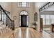 Spacious foyer featuring hardwood floors, a staircase, and a glimpse of the dining area at 93 Ridgetree Ln, Marietta, GA 30068