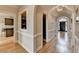 Hallway featuring hardwood floors leading to the front entrance with a view to the kitchen at 93 Ridgetree Ln, Marietta, GA 30068