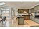 Bright eat-in kitchen boasts an island, breakfast bar, stainless steel appliances, and ample cabinet space at 93 Ridgetree Ln, Marietta, GA 30068