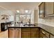 Kitchen with stainless steel dishwasher and granite countertops sits open to breakfast nook with skylights at 93 Ridgetree Ln, Marietta, GA 30068