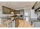 Stylish kitchen features an island with seating, granite countertops, and stainless steel appliances at 93 Ridgetree Ln, Marietta, GA 30068