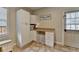Functional laundry area featuring cabinetry, countertop space, and convenient storage for laundry accessories at 93 Ridgetree Ln, Marietta, GA 30068