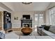 Comfortable living room featuring a fireplace, built-in shelves, and plenty of seating at 93 Ridgetree Ln, Marietta, GA 30068