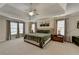 Spacious main bedroom with tray ceiling, large windows, and neutral decor at 93 Ridgetree Ln, Marietta, GA 30068