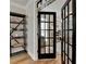 Office featuring french doors, hardwood flooring, and a metal bookshelf at 93 Ridgetree Ln, Marietta, GA 30068