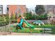Community playground with swings, slides, and climbing structures set on artificial turf at 93 Ridgetree Ln, Marietta, GA 30068