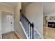 Staircase features carpeted steps, contrasting handrail, and hardwood flooring visible in entryway at 93 Ridgetree Ln, Marietta, GA 30068