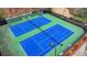 Overhead view of two well-maintained tennis courts, lighted for nighttime play, with benches between courts at 93 Ridgetree Ln, Marietta, GA 30068