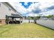 Large backyard features a gazebo with seating, perfect for outdoor entertaining and relaxing at 13568 Scenic Pkwy, Covington, GA 30014