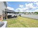 Spacious backyard oasis featuring a gazebo with comfortable seating and manicured lawn at 13568 Scenic Pkwy, Covington, GA 30014
