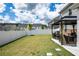 Backyard featuring white fence, a gazebo with outdoor seating, and lush green grass at 13568 Scenic Pkwy, Covington, GA 30014