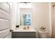 Bright bathroom featuring updated vanity and toilet with modern fixtures at 13568 Scenic Pkwy, Covington, GA 30014